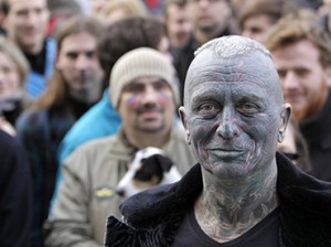 Vladimir Franz, university teacher, painter and composer who has tattoos covering 90 percent of his body attends a rally in Prague