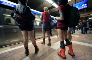 Passengers without pants wait for the subway train during "The No Pants Subway Ride" in Bucharest